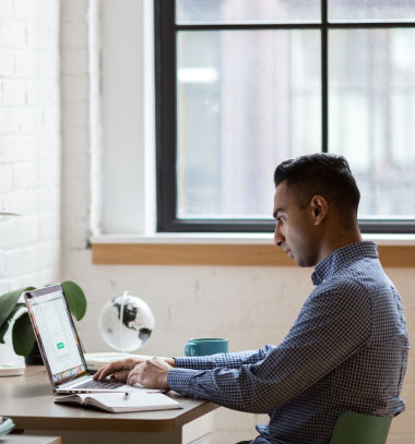 Developer sitting at a desk doing an online course. CC image courtesy of Publicity Pod on Flickr